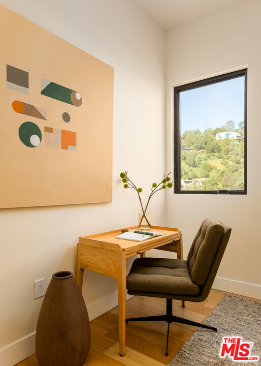 512 Rustic Drive Los Angeles, CA 90065 - Photo 27 of 53 a bedroom with a chair and wooden floor