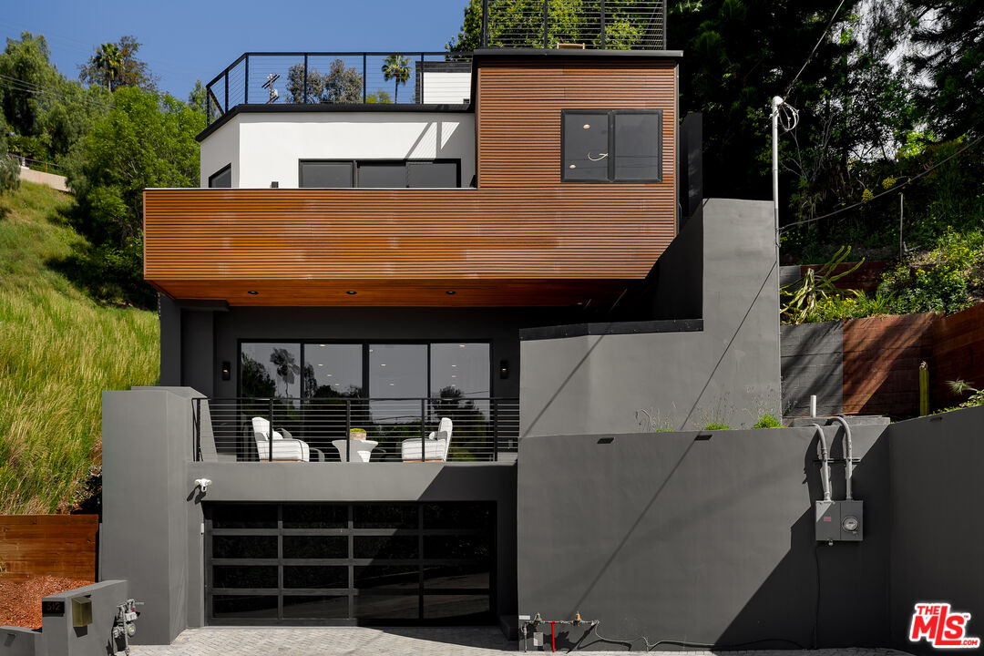 512 Rustic Drive Los Angeles, CA 90065 - Photo 3 of 53 a view of a house with a balcony and wooden floor