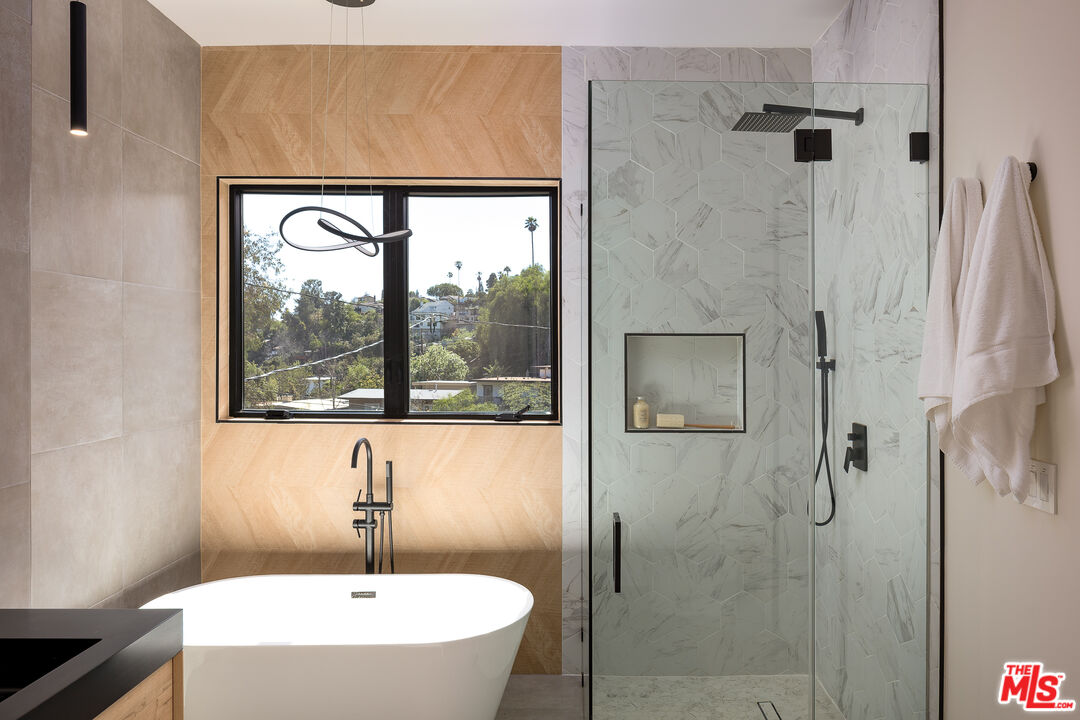512 Rustic Drive Los Angeles, CA 90065 - Photo 35 of 53 a bathroom with a bathtub and a shower