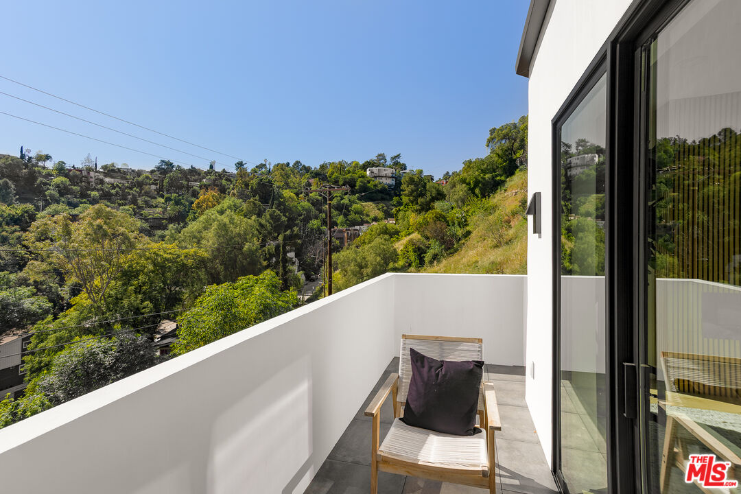 512 Rustic Drive Los Angeles, CA 90065 - Photo 36 of 53 a view of a balcony with wooden floor and outdoor space