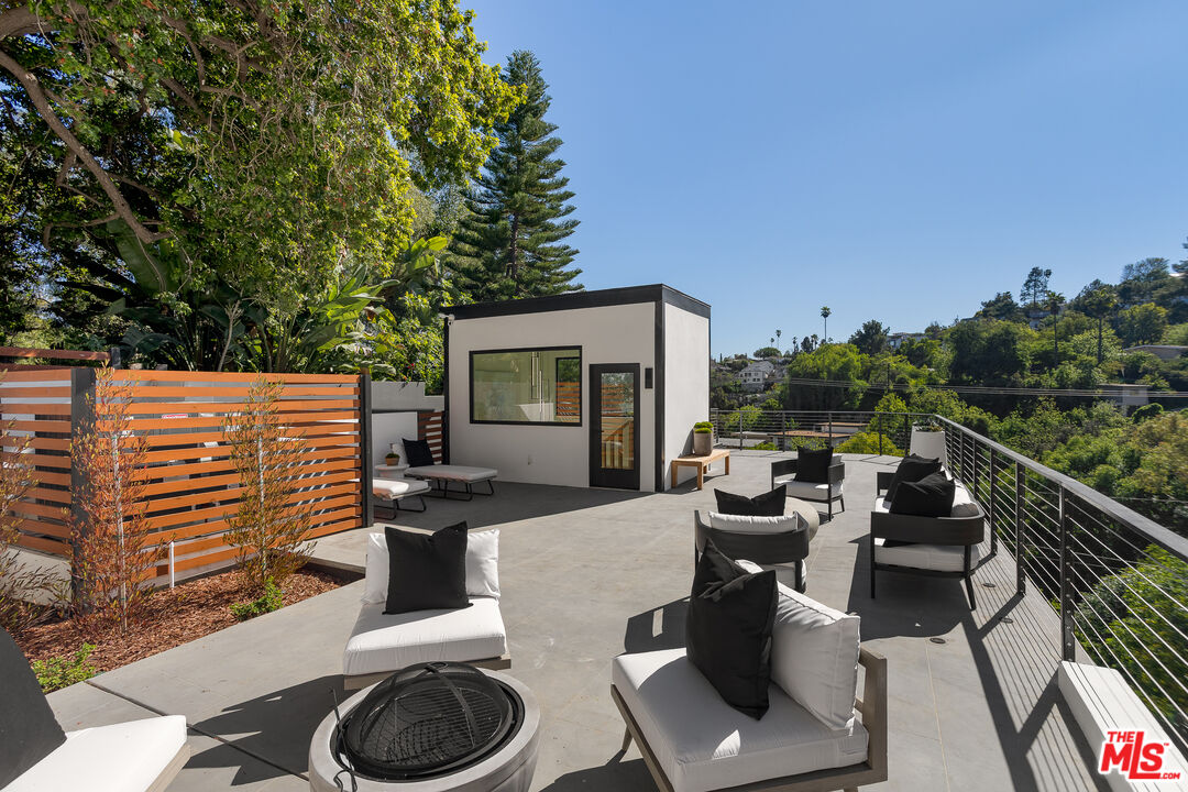 512 Rustic Drive Los Angeles, CA 90065 - Photo 41 of 53 a view of a patio with couches chairs and a potted plant