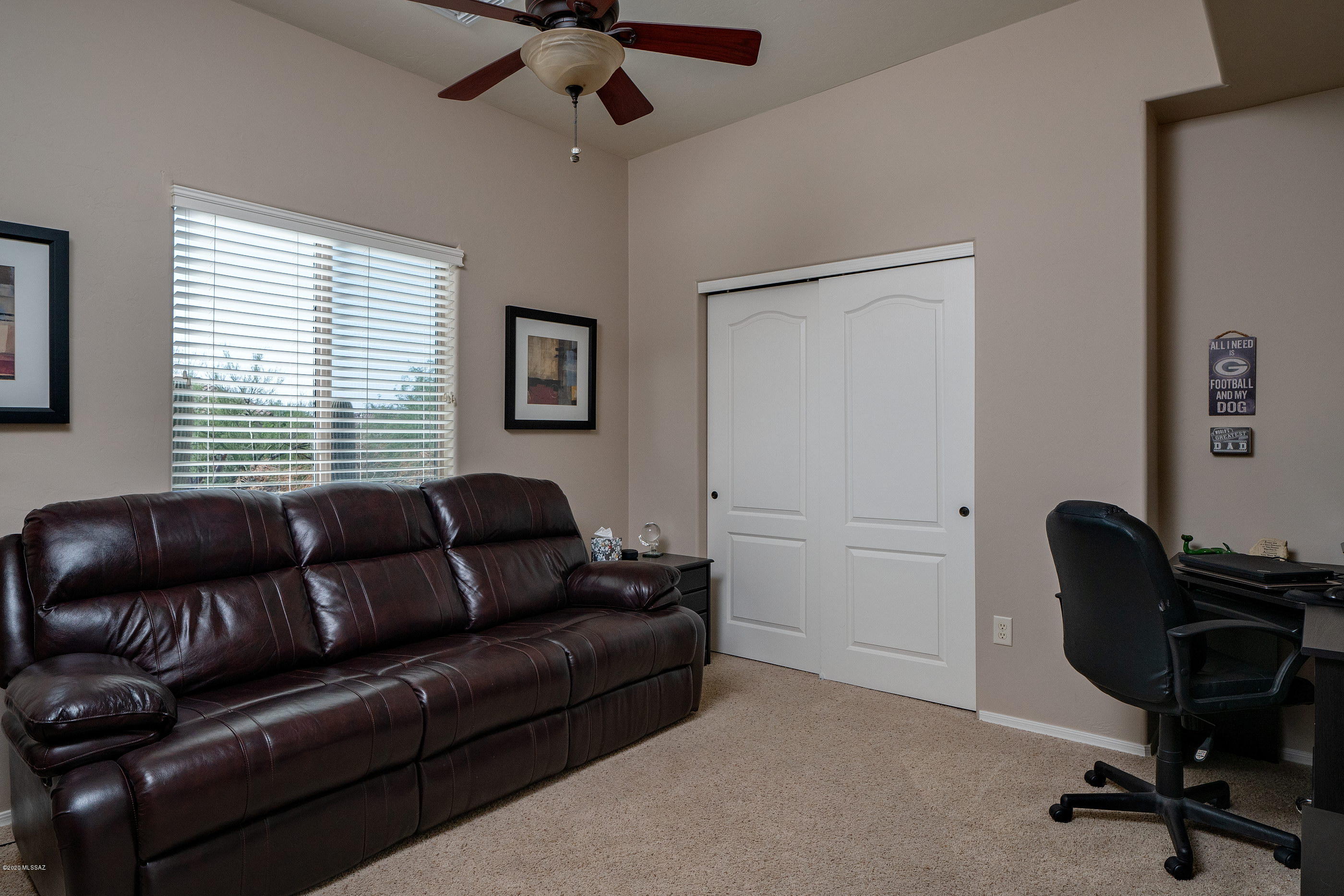 4440 West Crystal Ranch Place Marana, AZ 85658 - Photo 23 of 28 a living room with furniture and a window
