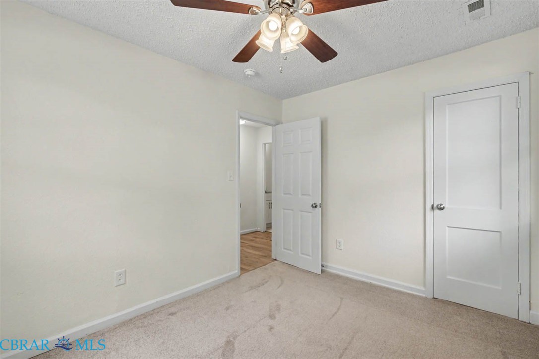 914 Ridgeway Avenue Hampton, VA 23661 - Photo 23 of 33 a view of an empty room and chandelier fan