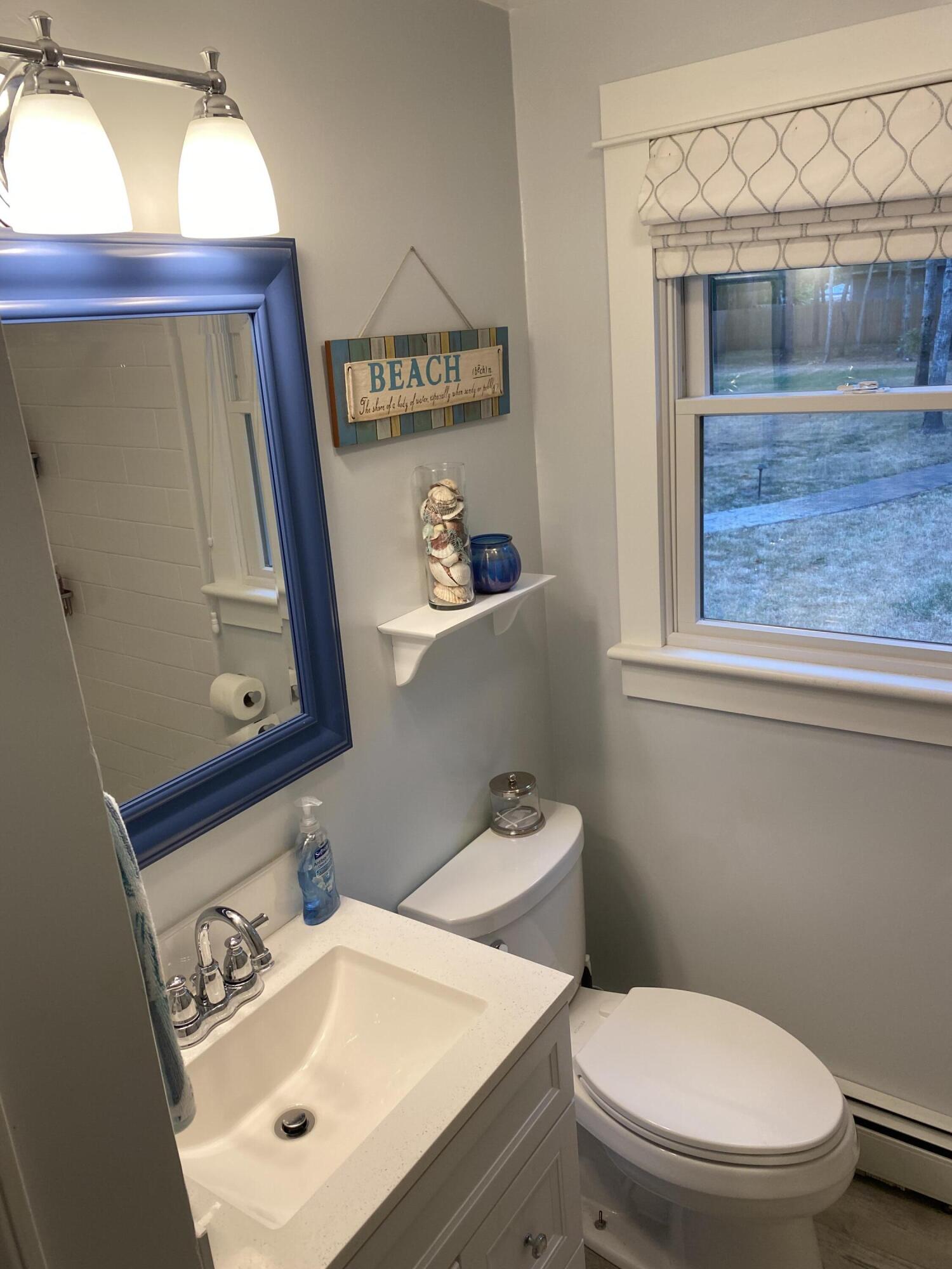 65 Kelley Road Hyannis, MA 02601 - Photo 19 of 38 a white toilet sitting next to a bathroom sink