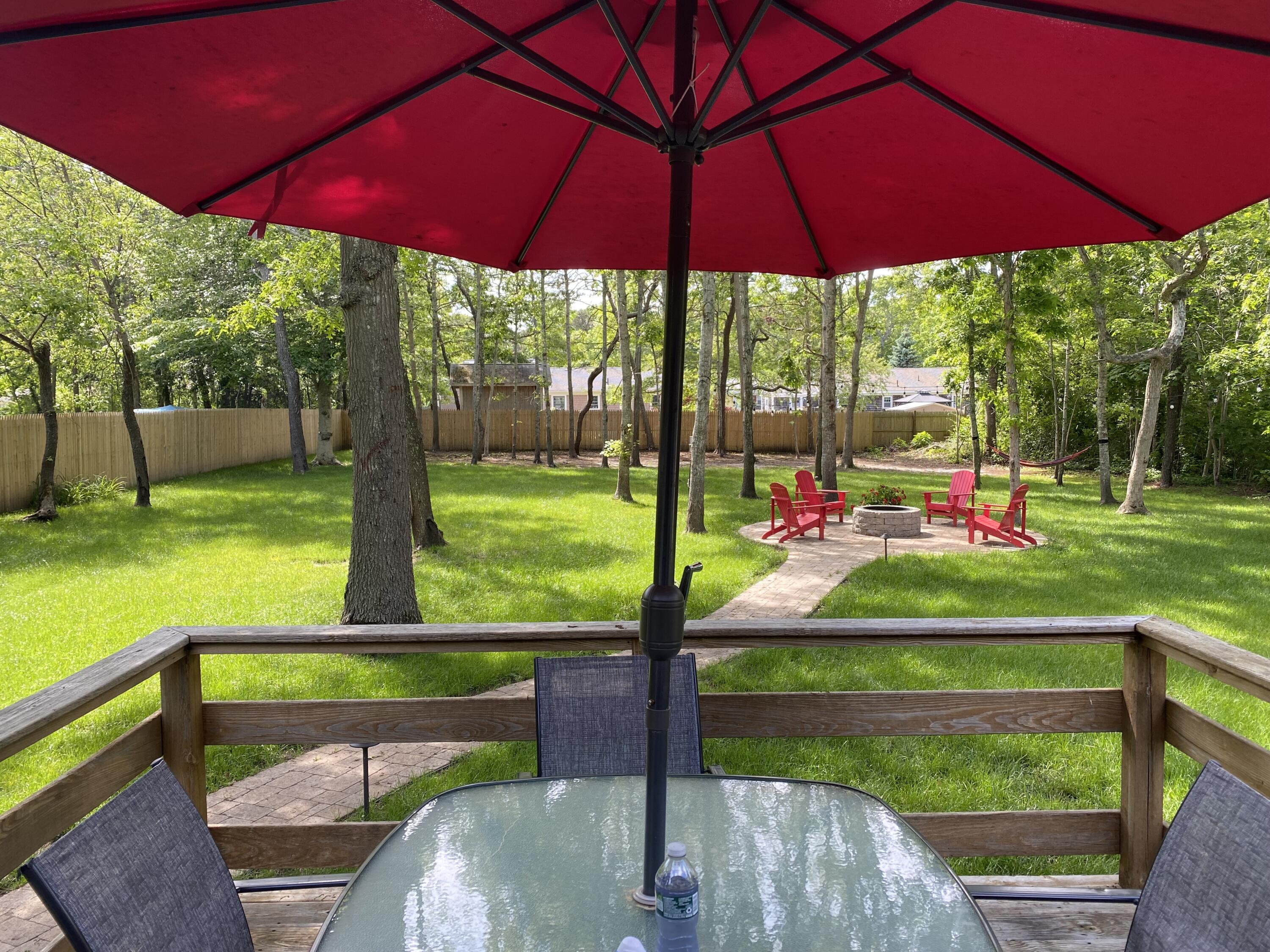 65 Kelley Road Hyannis, MA 02601 - Photo 23 of 38 a view of yard with a table and sitting area