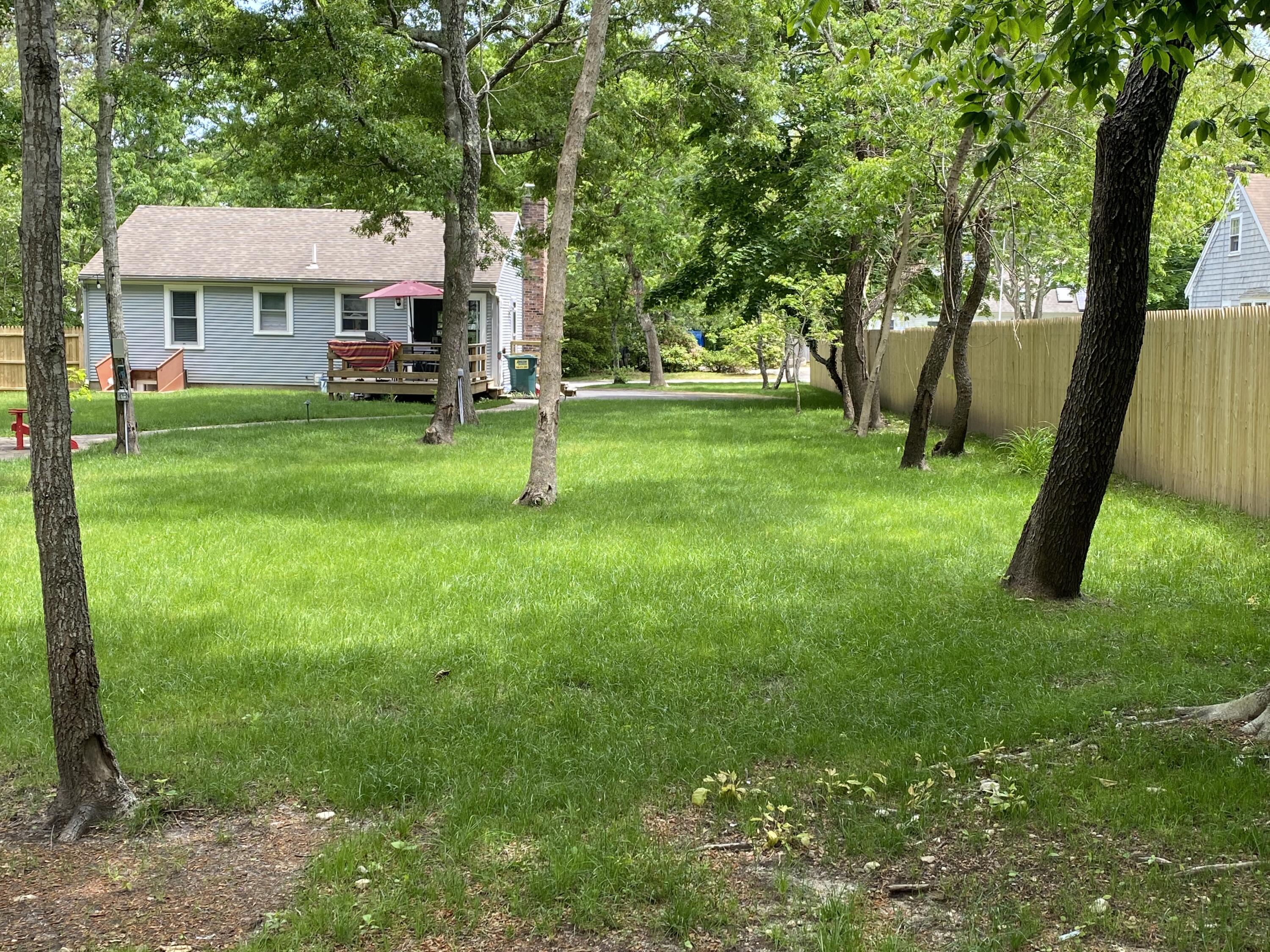 65 Kelley Road Hyannis, MA 02601 - Photo 26 of 38 a front view of a house with a yard