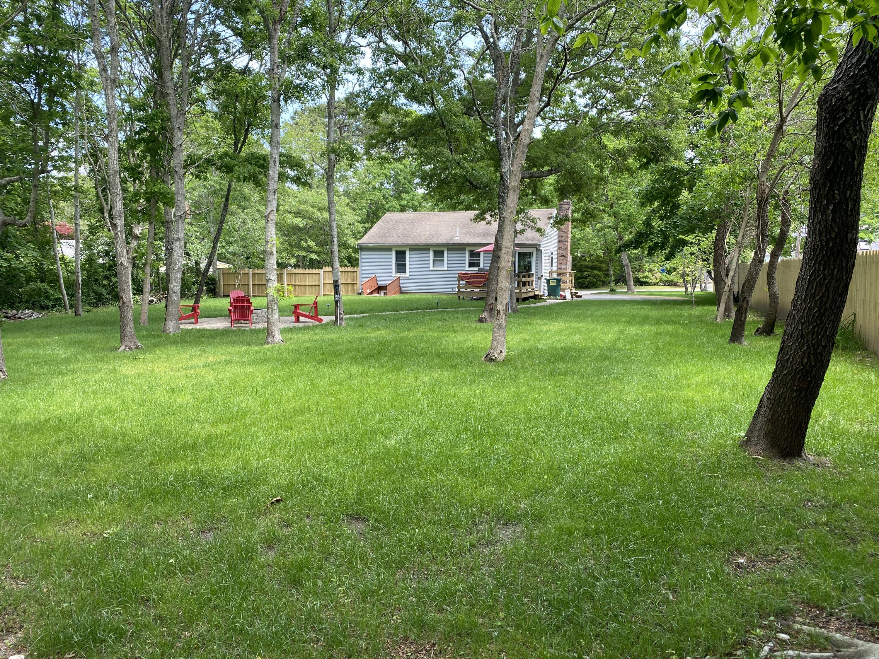65 Kelley Road Hyannis, MA 02601 - Photo 27 of 38 a view of a house with backyard and sitting area