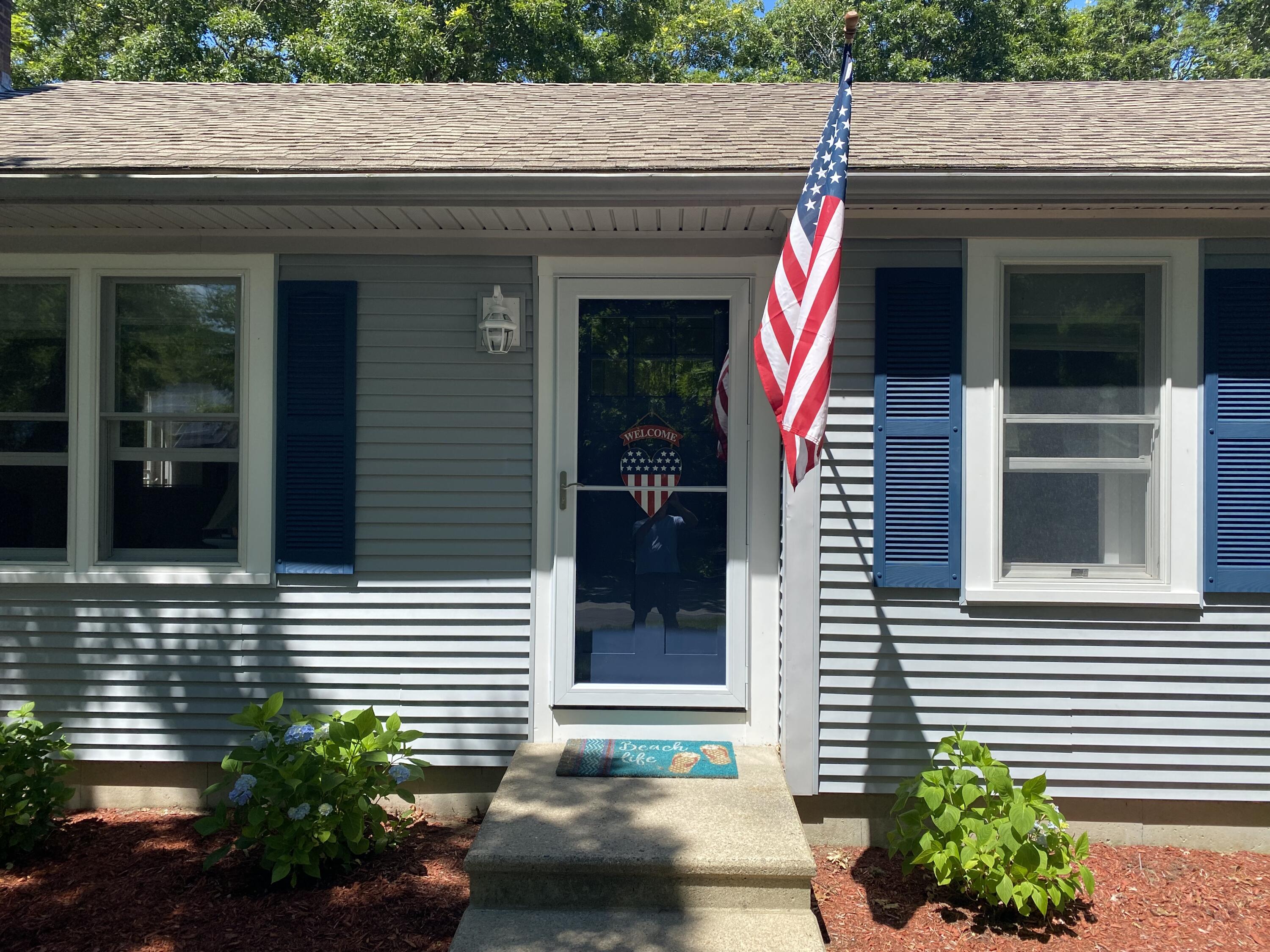 65 Kelley Road Hyannis, MA 02601 - Photo 5 of 38 a view of a house with potted plants