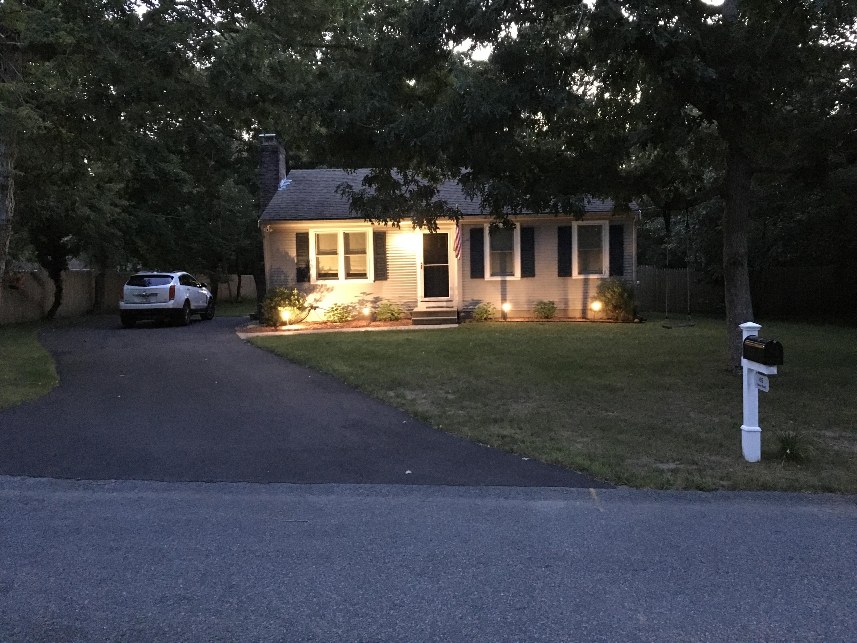 65 Kelley Road Hyannis, MA 02601 - Photo 6 of 38 a front view of a house with a yard