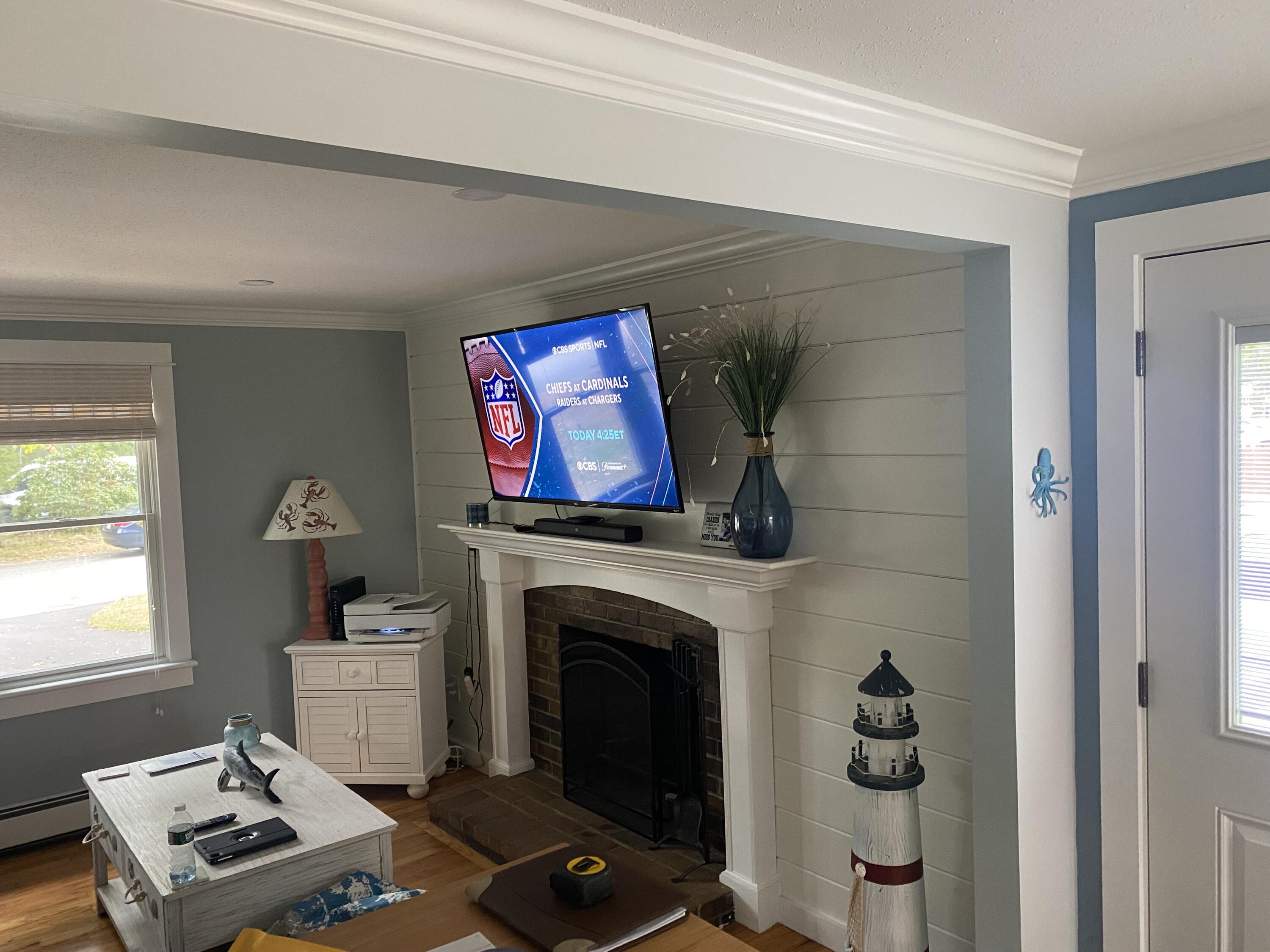 65 Kelley Road Hyannis, MA 02601 - Photo 10 of 38 a living room with furniture a fireplace and a window