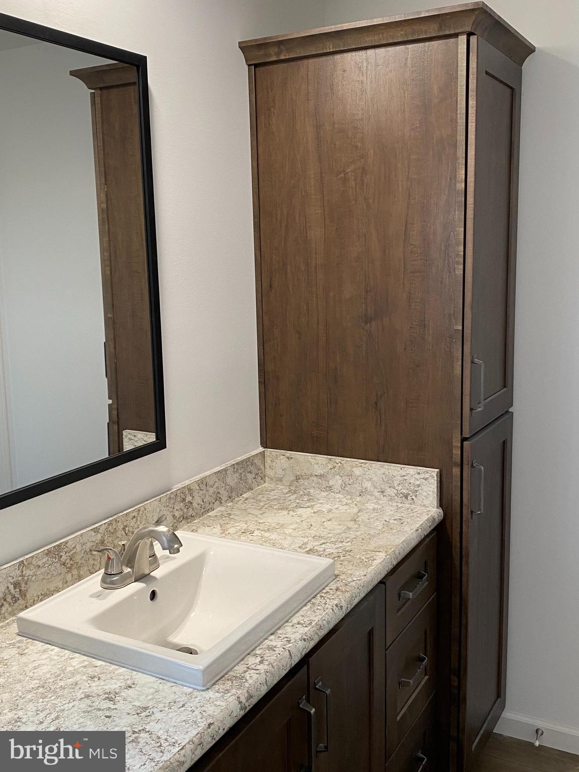 1751 Hilltown Road Biglerville, PA 17307 - Photo 11 of 15 a bathroom with a granite countertop sink and a mirror