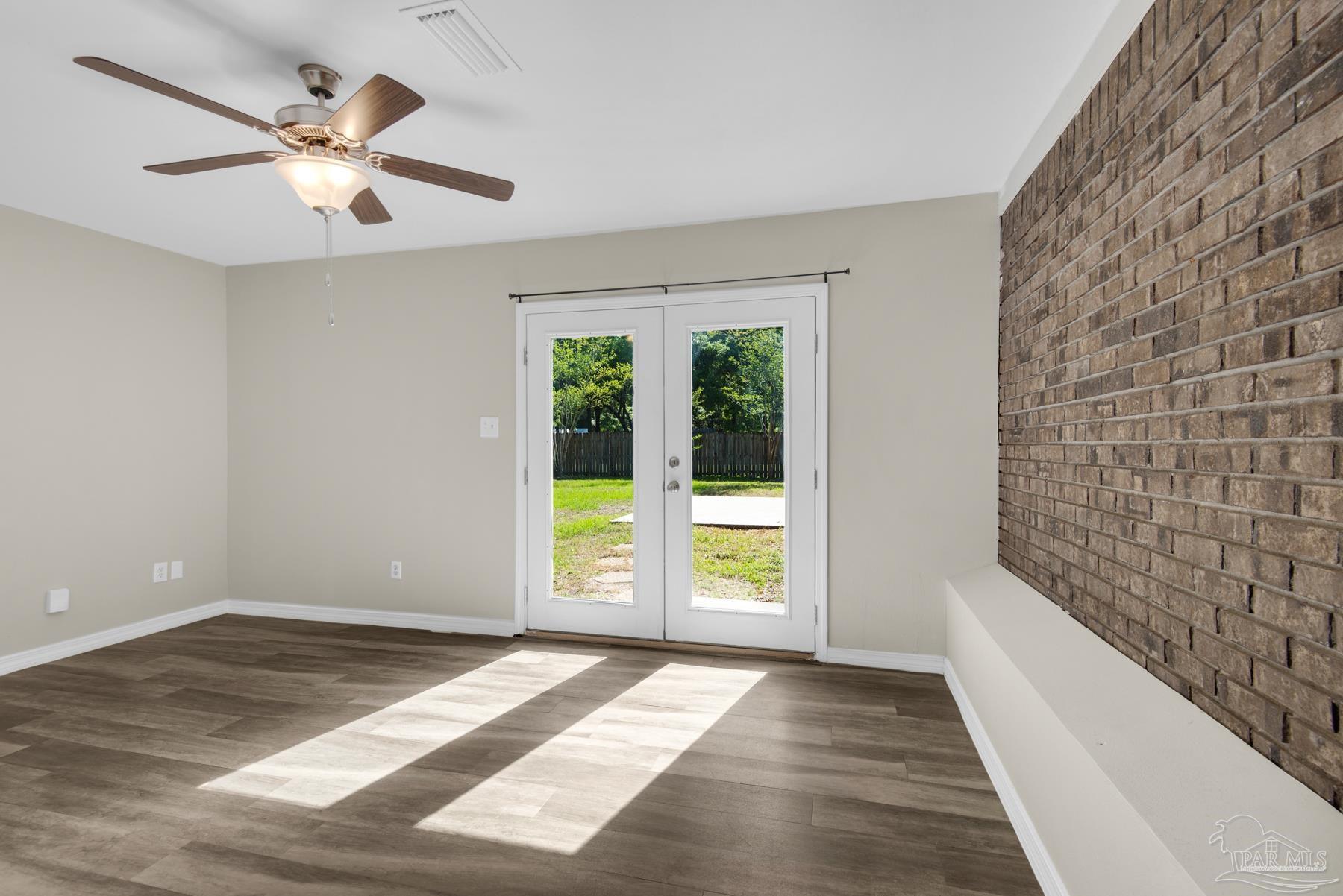 5804 Gulf Road Milton, FL 32583 - Photo 45 of 54 a view of an empty room with a window