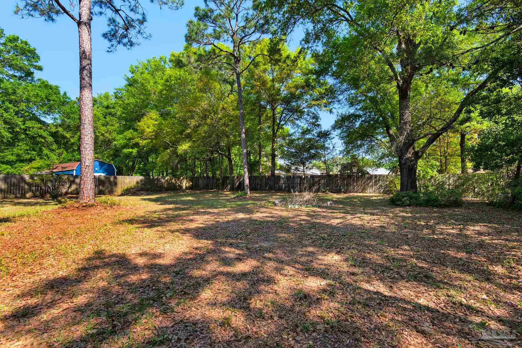 5804 Gulf Road Milton, FL 32583 - Photo 54 of 54 a backyard of a house with lots of green space