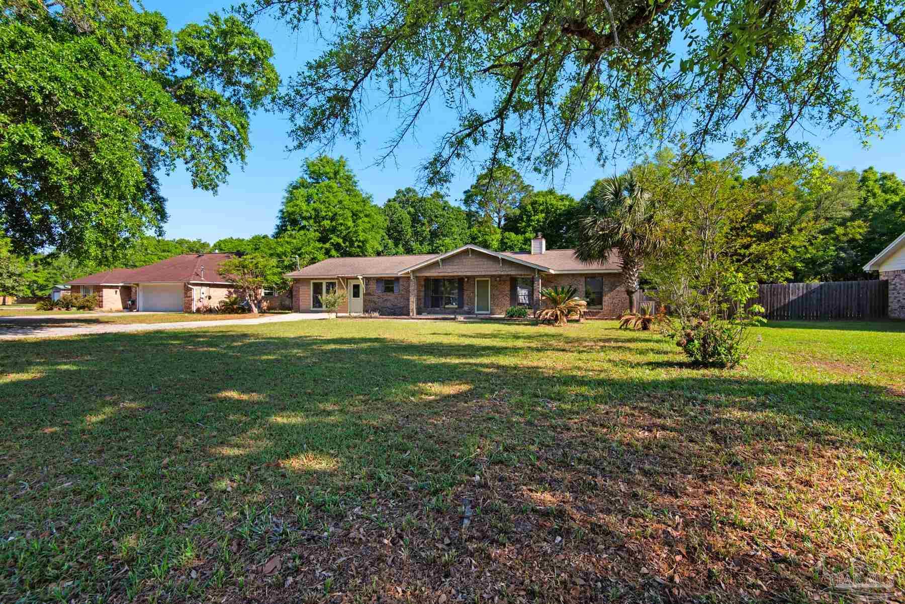 5804 Gulf Road Milton, FL 32583 - Photo 6 of 54 a house view with a outdoor space