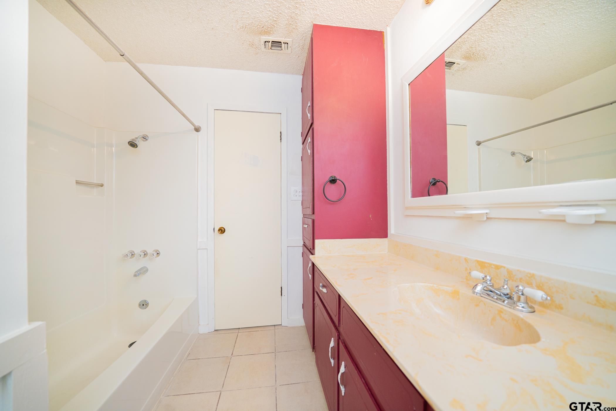 1332 Cr 4840 Mount Mount Pleasant, TX 75455 - Photo 20 of 38 a bathroom with a sink vanity tub and shower