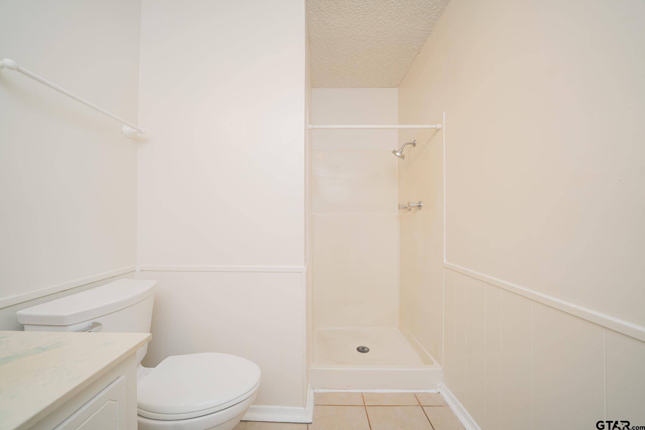 1332 Cr 4840 Mount Mount Pleasant, TX 75455 - Photo 25 of 38 a white toilet sitting next to a shower