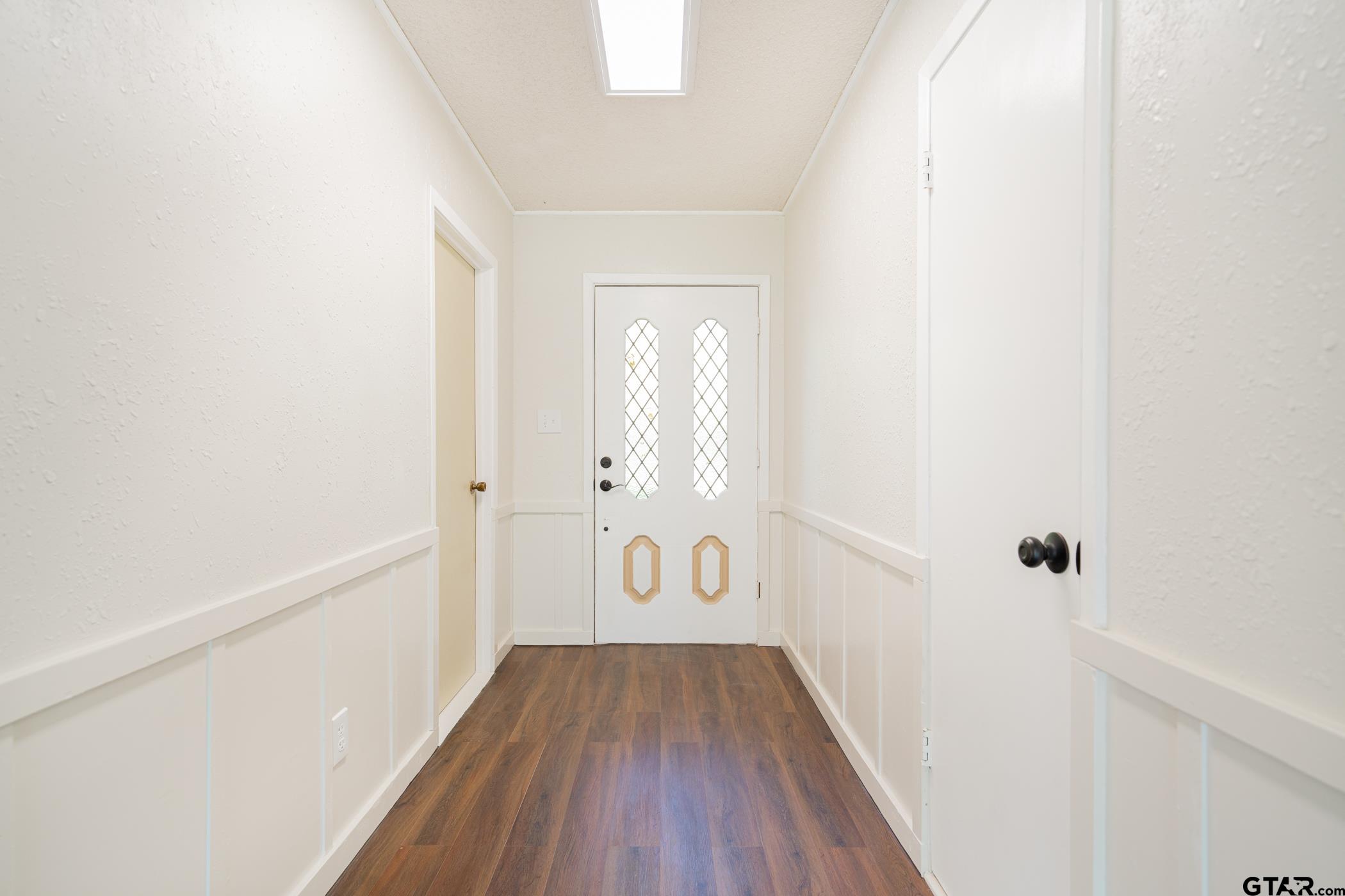 1332 Cr 4840 Mount Mount Pleasant, TX 75455 - Photo 7 of 38 a view of a hallway with wooden floor and staircase