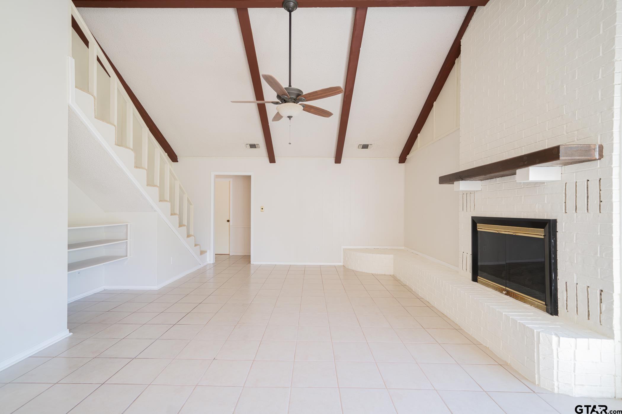 1332 Cr 4840 Mount Mount Pleasant, TX 75455 - Photo 9 of 38 a view of an empty room with wooden floor and a window