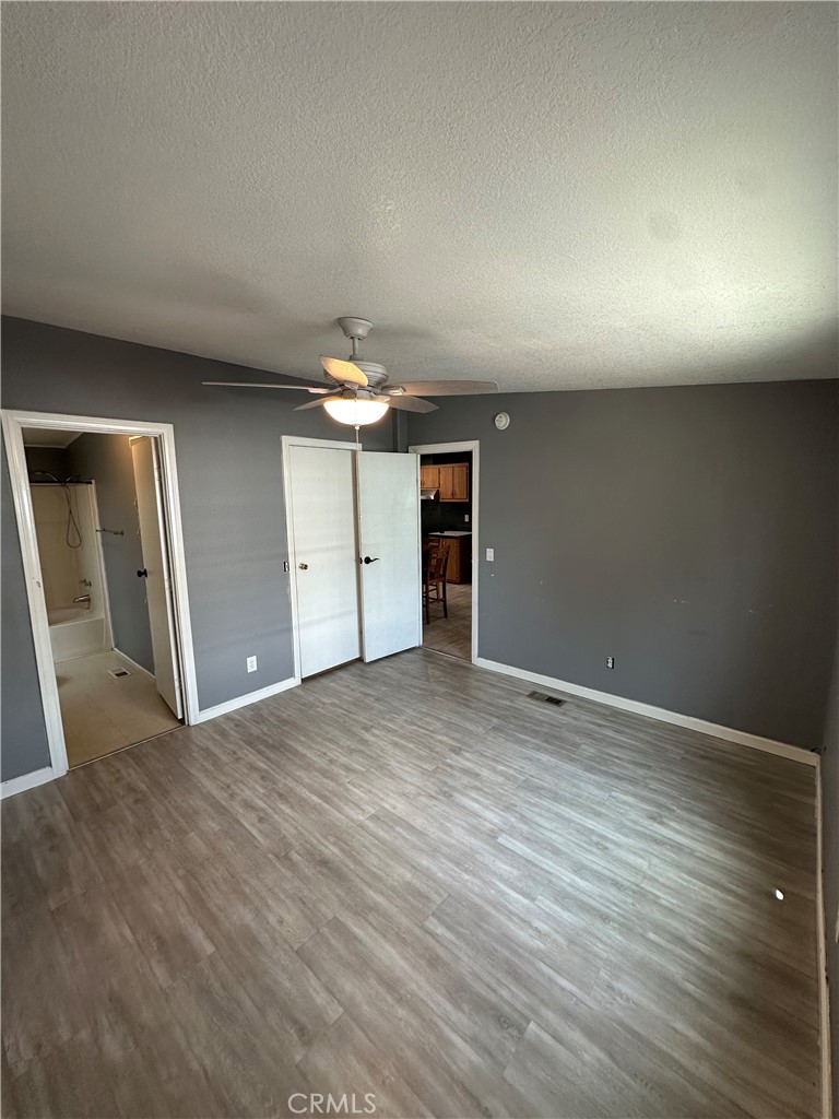 3825 Crestmore Road, Unit 414 Riverside, CA 92509 - Photo 12 of 31 a view of an empty room and wooden floor