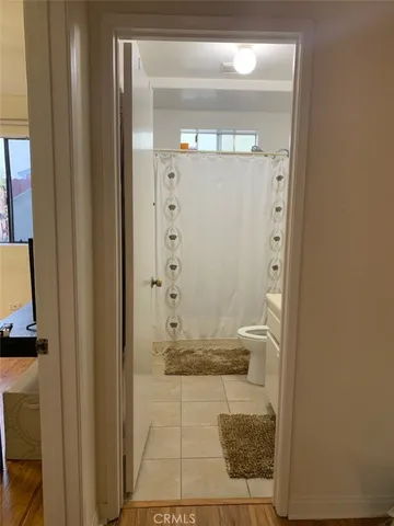 a bathroom with a glass shower door