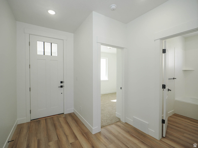 3938 North Wood Road Eagle Mountain, UT 84005 - Photo 6 of 55 Entryway with plenty of natural light, light wood finished floors, and recessed lighting