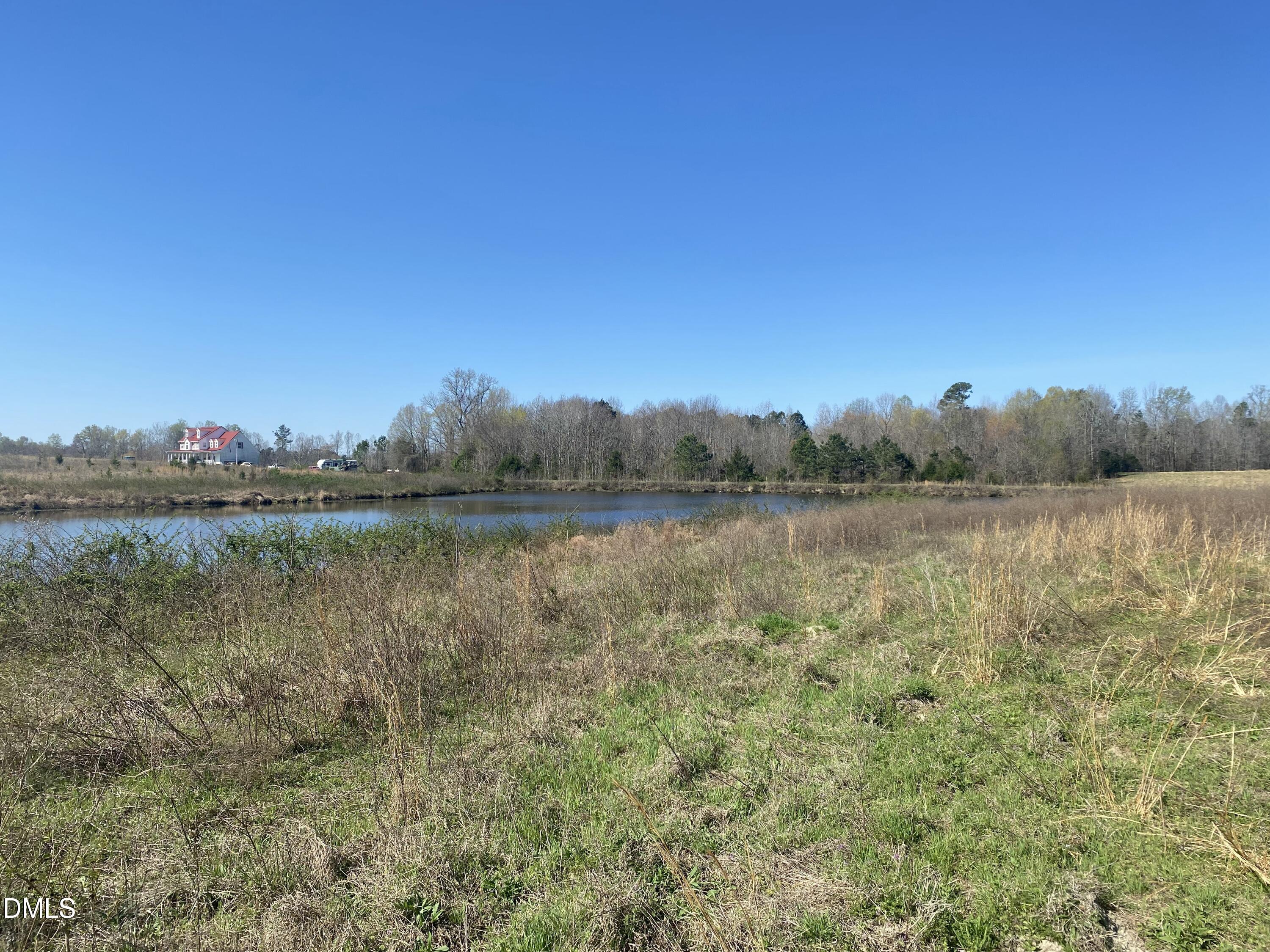 6020 Corbett Ridge Road Mebane, NC 27302 - Photo 5 of 12 a view of a lake with outdoor space