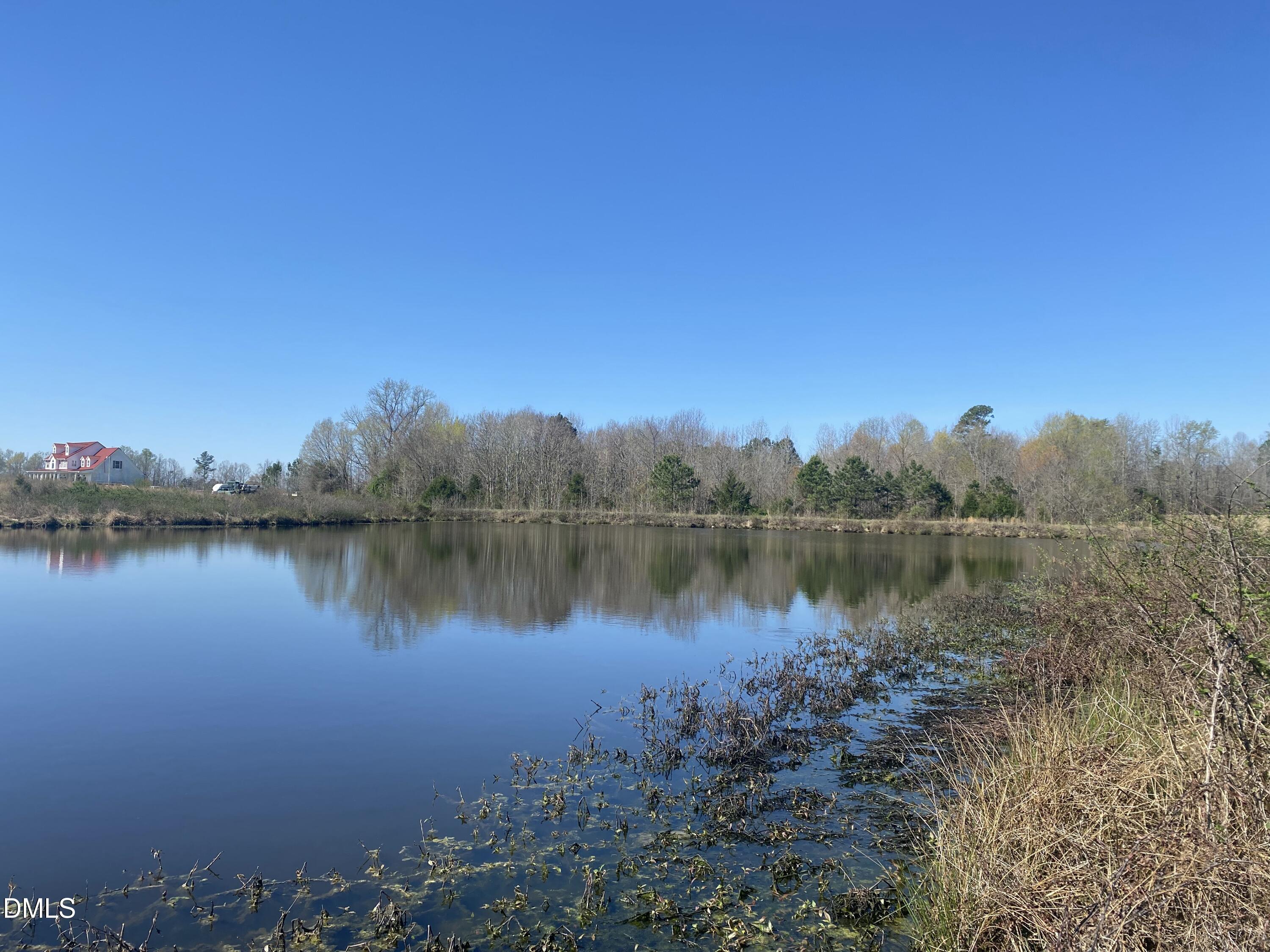 6020 Corbett Ridge Road Mebane, NC 27302 - Photo 6 of 12 a view of a lake with a city