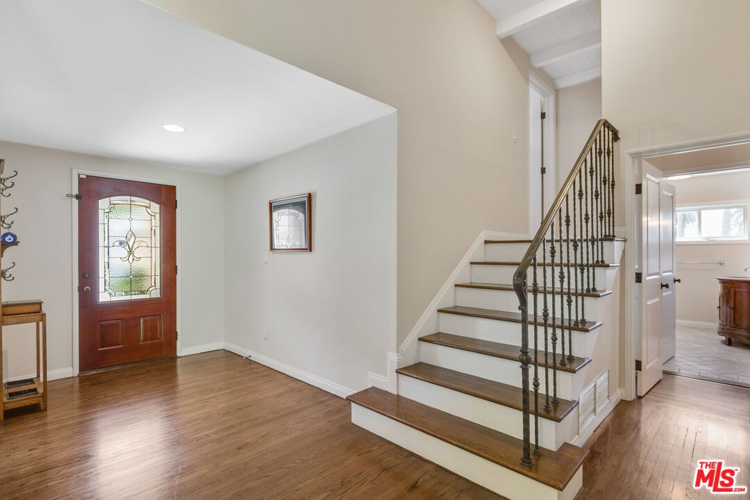 811 Jacon Way Pacific Palisades, CA 90272 - Photo 13 of 25 a view of entryway with wooden floor and stairs