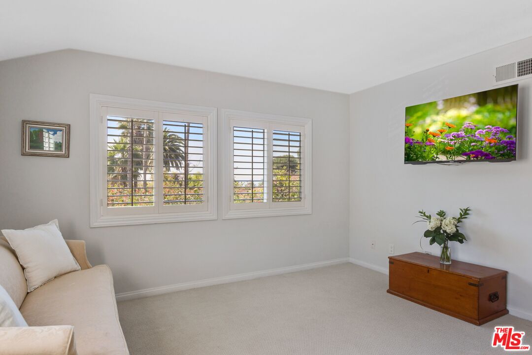 811 Jacon Way Pacific Palisades, CA 90272 - Photo 15 of 25 a living room with furniture and a flat screen tv