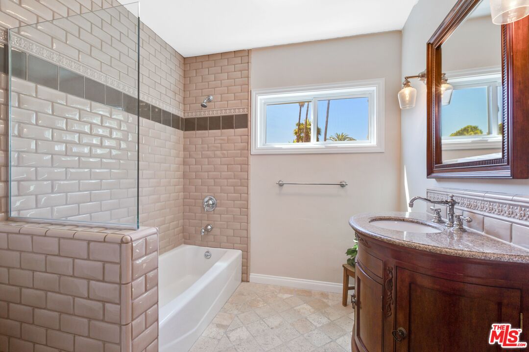 811 Jacon Way Pacific Palisades, CA 90272 - Photo 22 of 25 a bathroom with a sink a bathtub and a mirror