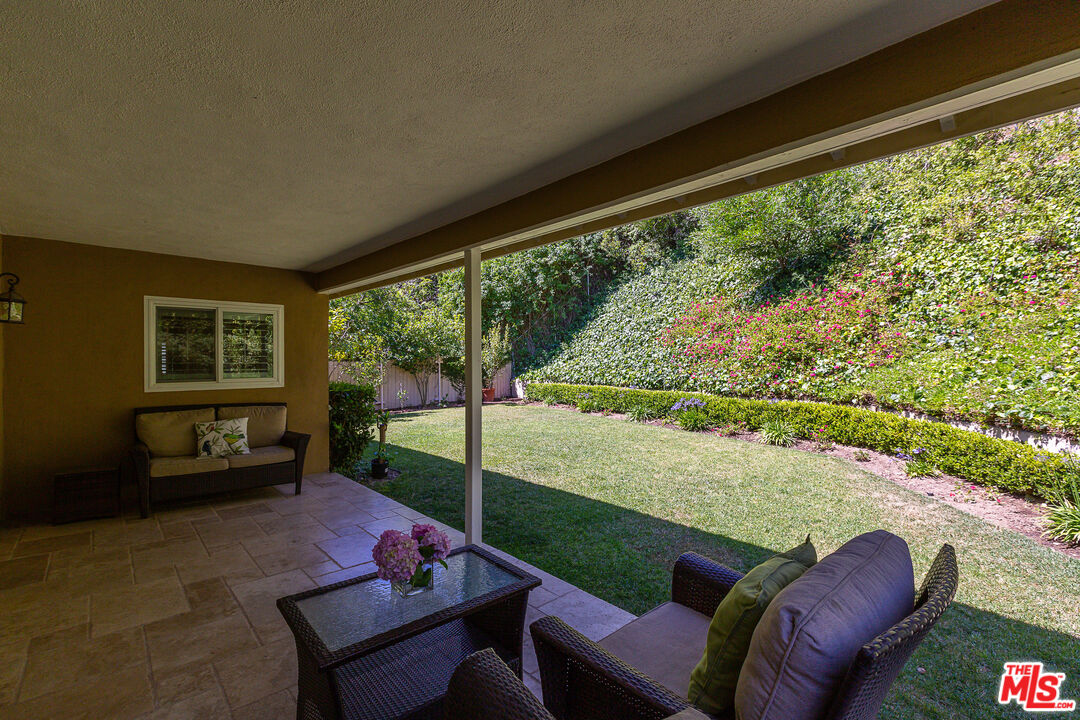811 Jacon Way Pacific Palisades, CA 90272 - Photo 24 of 25 a balcony with couple of chairs and a couch