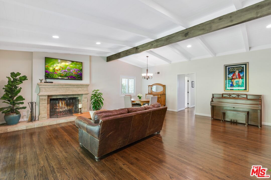 811 Jacon Way Pacific Palisades, CA 90272 - Photo 5 of 25 a living room with furniture and a fireplace