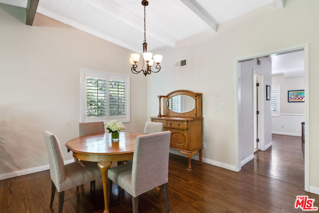 811 Jacon Way Pacific Palisades, CA 90272 - Photo 6 of 25 a view of a dining room with furniture a chandelier and wooden floor