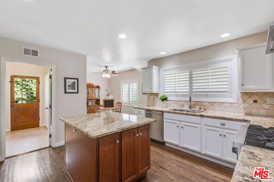 811 Jacon Way Pacific Palisades, CA 90272 - Photo 10 of 25 a kitchen with a sink stove and cabinets