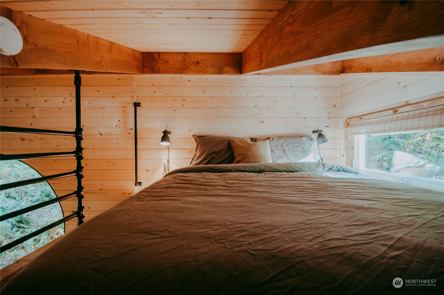 51822 South Riverside Road Gold Bar, WA 98251 - Photo 27 of 40 a bedroom with a bed and wooden floor