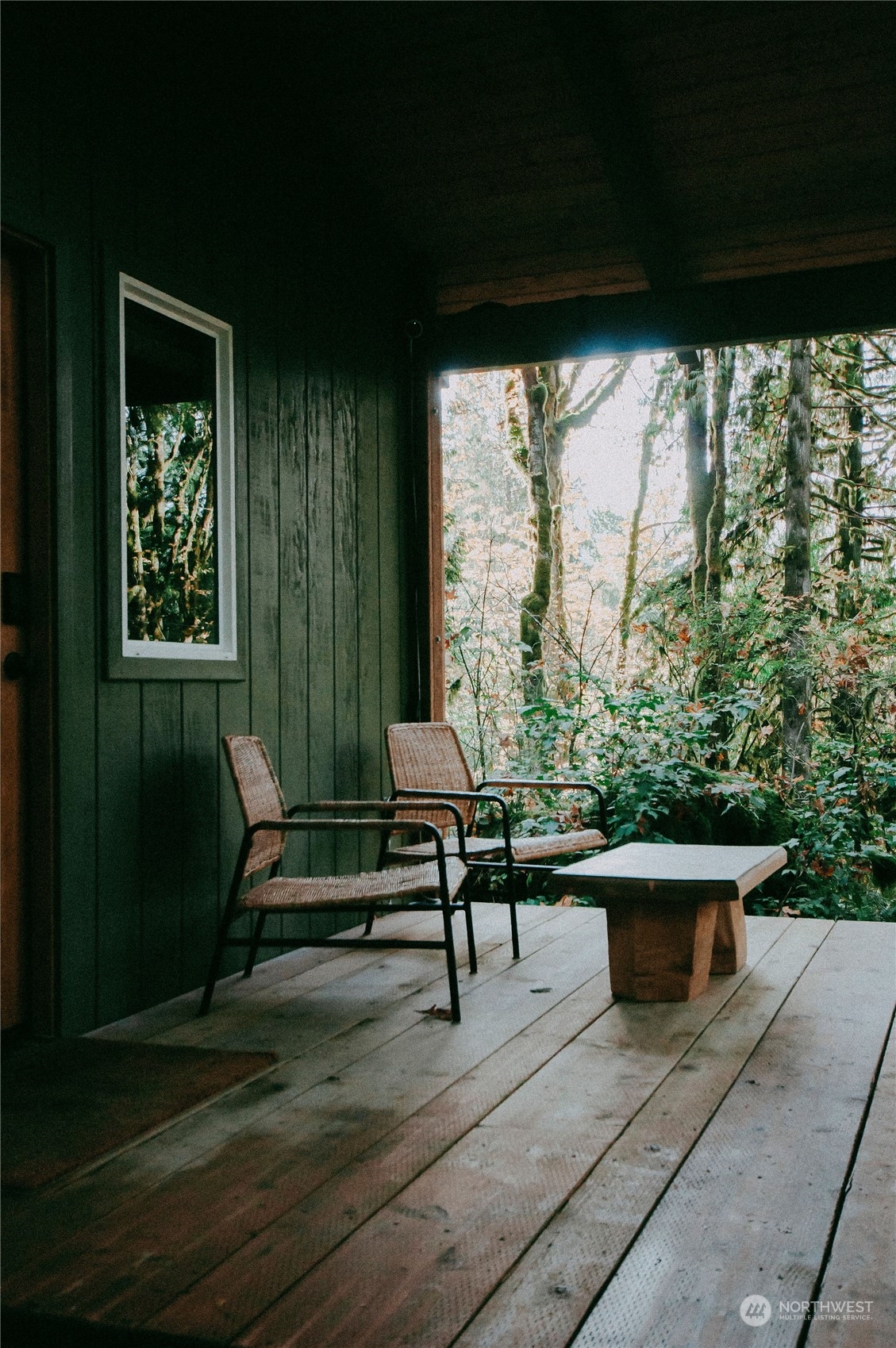 51822 South Riverside Road Gold Bar, WA 98251 - Photo 31 of 40 a view of a porch with chairs and a yard