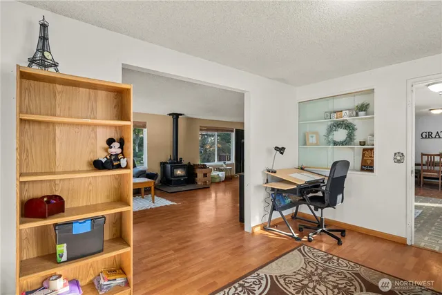 a view of a workspace with furniture and a kitchen