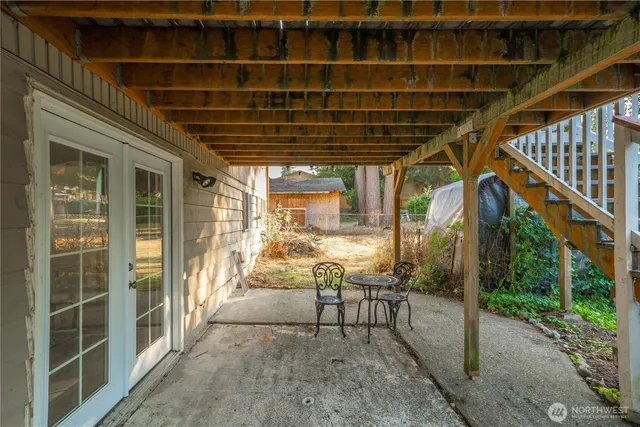 a view of a porch with chairs and floor