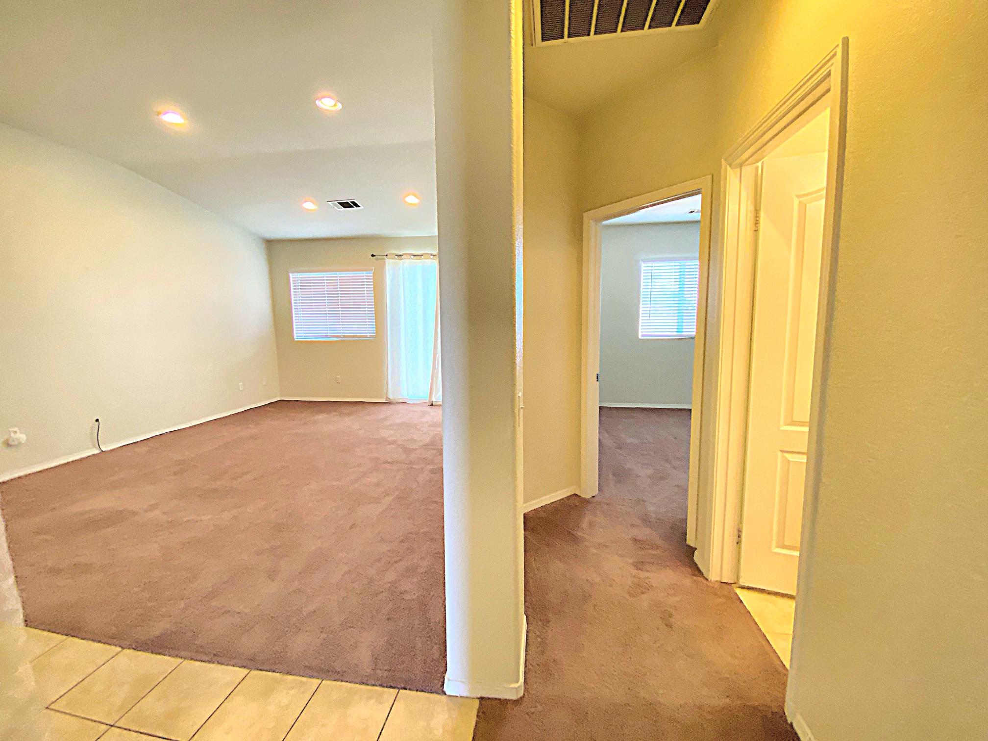 2751 Garnet Lane Lancaster, CA 93535 - Photo 25 of 46 a view of a hallway with wooden floor