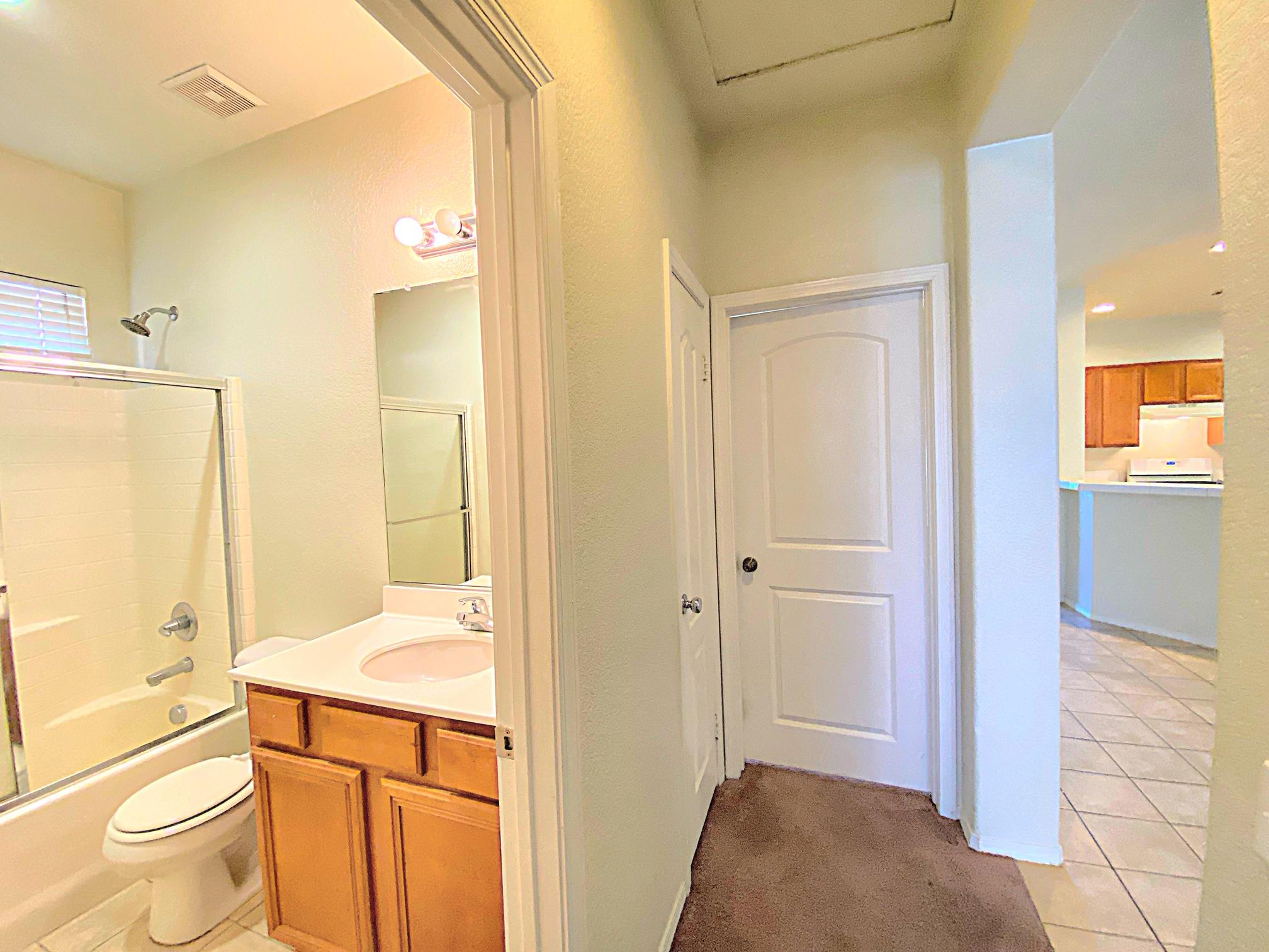 2751 Garnet Lane Lancaster, CA 93535 - Photo 26 of 46 a bathroom with a granite countertop sink toilet and shower