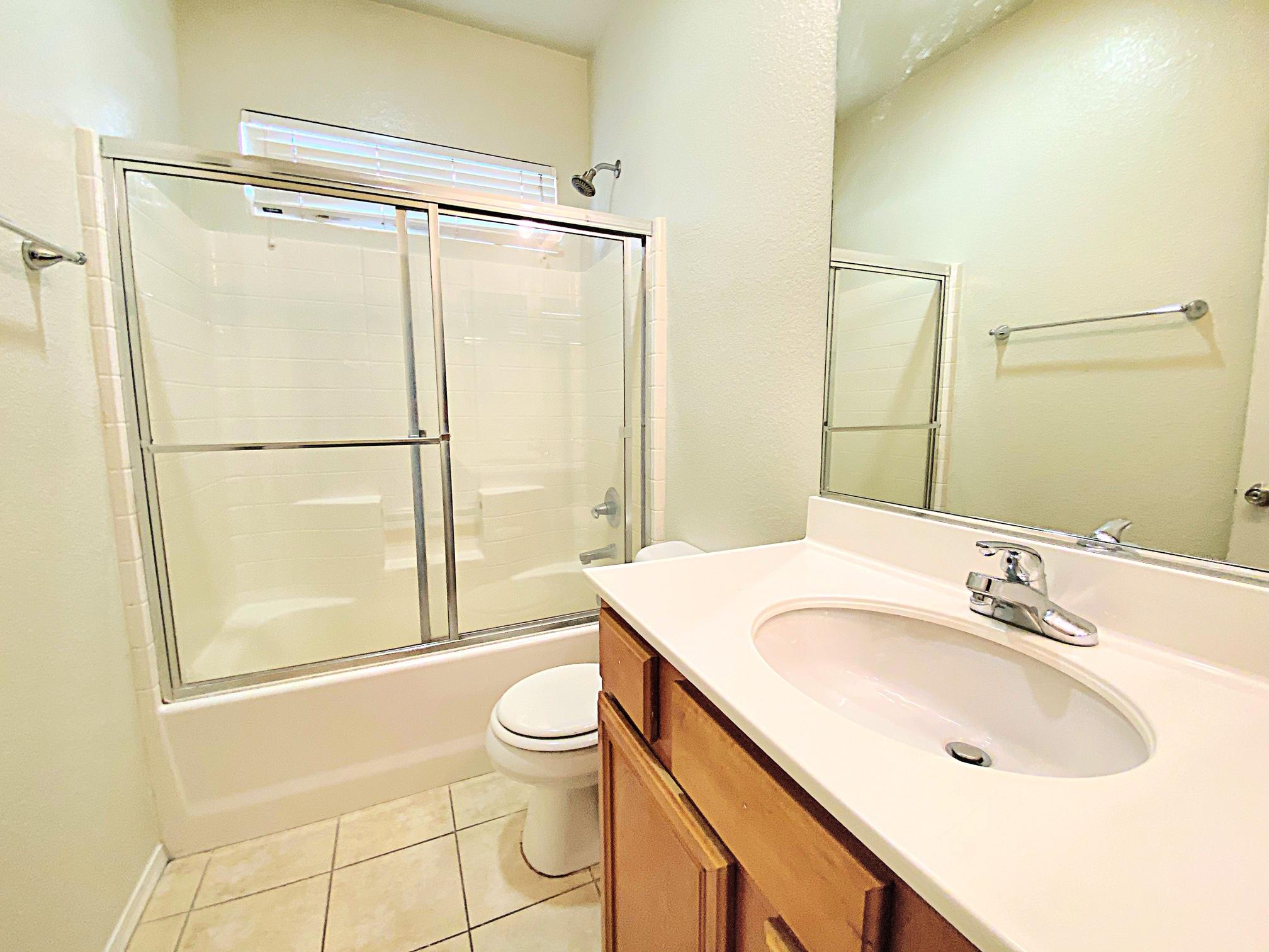 2751 Garnet Lane Lancaster, CA 93535 - Photo 27 of 46 a bathroom with a sink toilet and shower