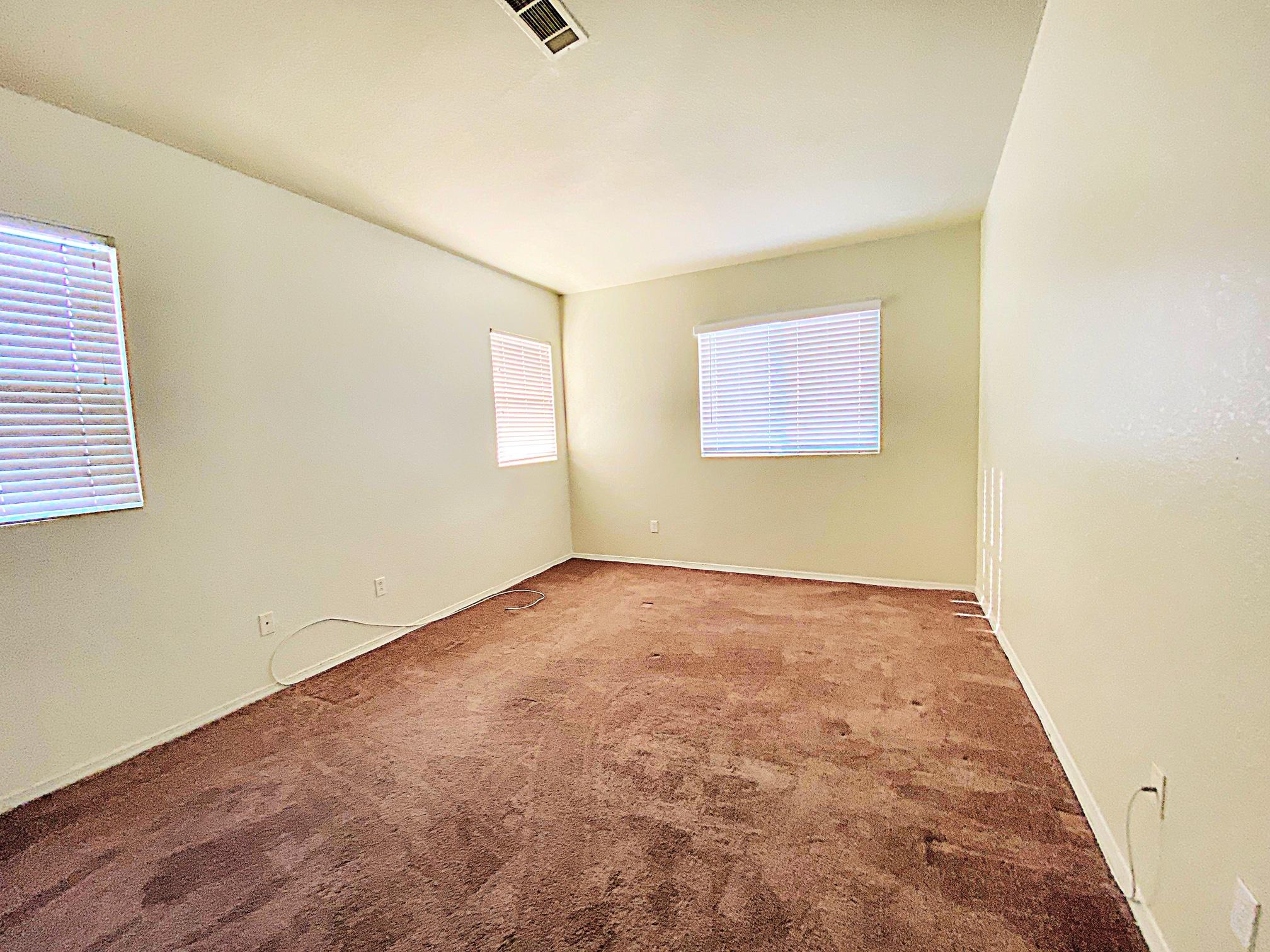 2751 Garnet Lane Lancaster, CA 93535 - Photo 35 of 46 an empty room with a empty space and windows