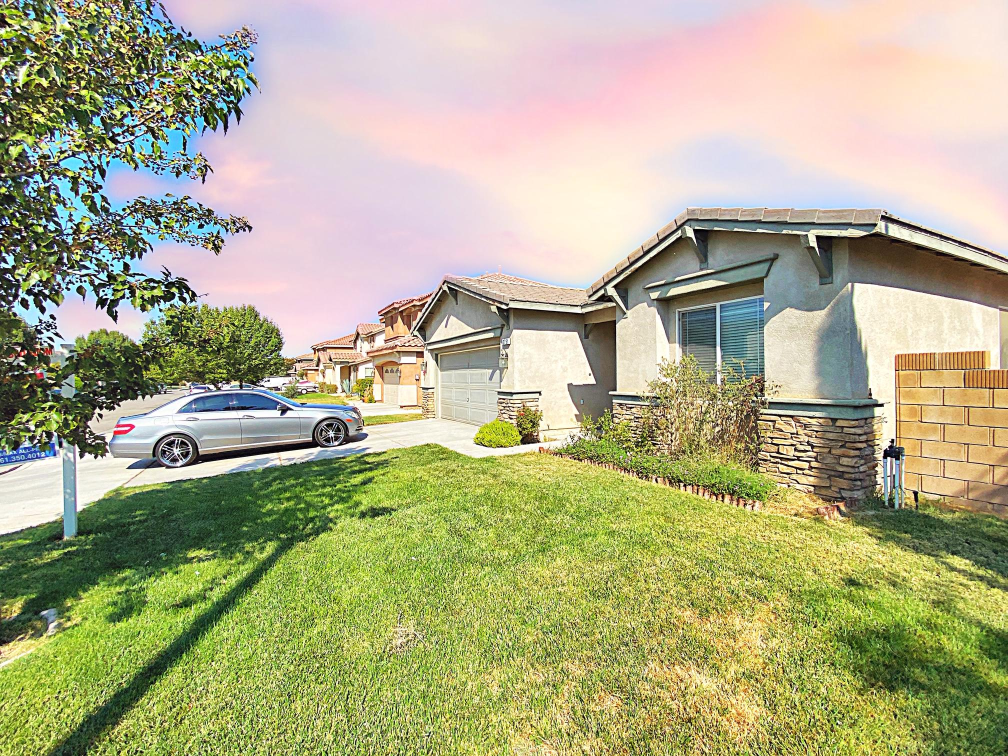 2751 Garnet Lane Lancaster, CA 93535 - Photo 5 of 46 a front view of a house with a yard