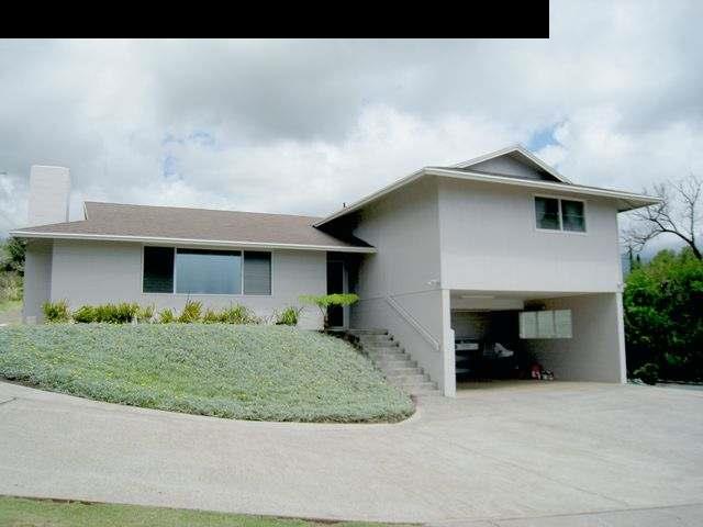 2040 L Kula Road Kula, HI 96790 - Photo 1 of 30 a front view of a house with a yard and garage