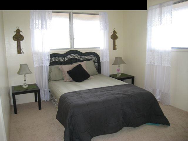 2040 L Kula Road Kula, HI 96790 - Photo 15 of 30 a bedroom with a bed and a window