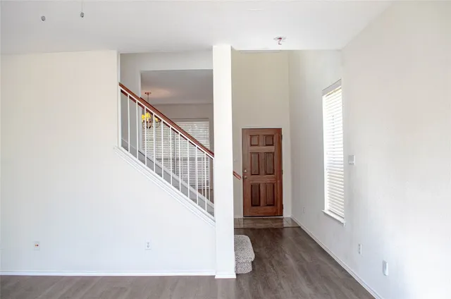 a view of an entryway with wooden floor