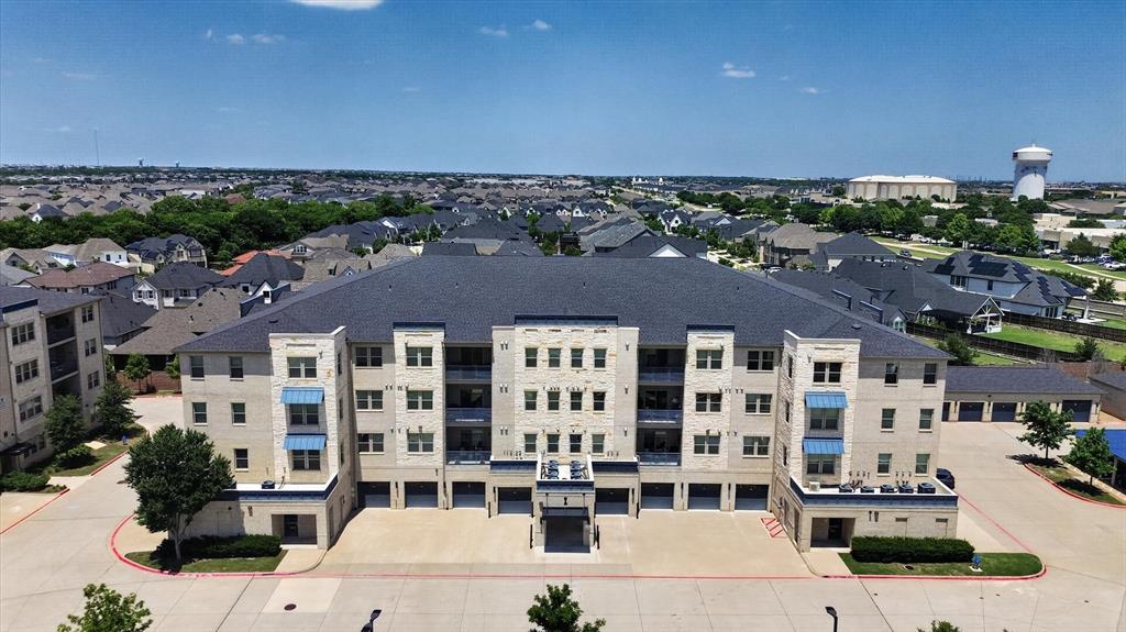 651 Watters Road, Unit 5305 Allen, TX 75013 - Photo 29 of 40 a view of building with an outdoor space