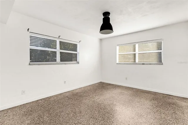 a view of empty room with windows