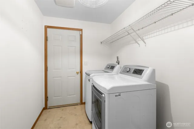 a view of staircase with white walls and windows