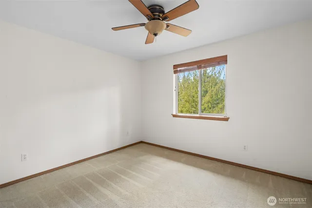 a aerial view of a house with a yard and outdoor seating